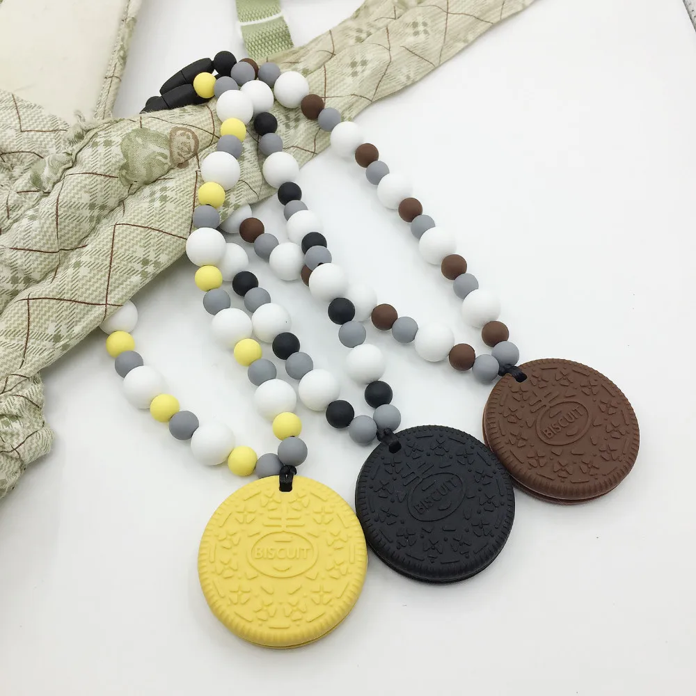 

FREE SHIPPING! Silicone Baby Carrier Teether - Oreo like cookie teether - Hangs on Baby Carrier!