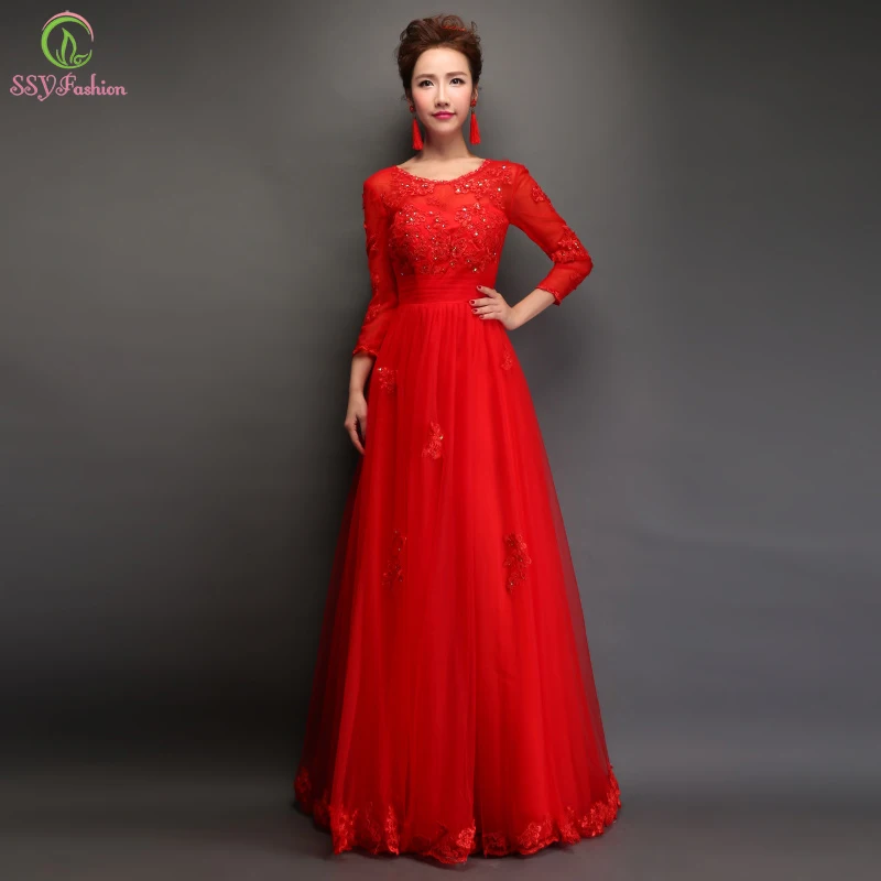 Red long sleeve formal dress with lace overlays