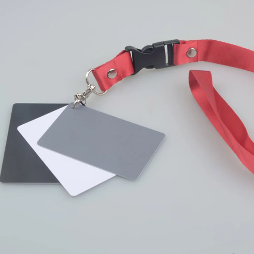 

Andoer 3 in 1 Digital White Black Grey Balance Cards 18% Gray Card Pocket-Size for Digital Photography with Neck Strap