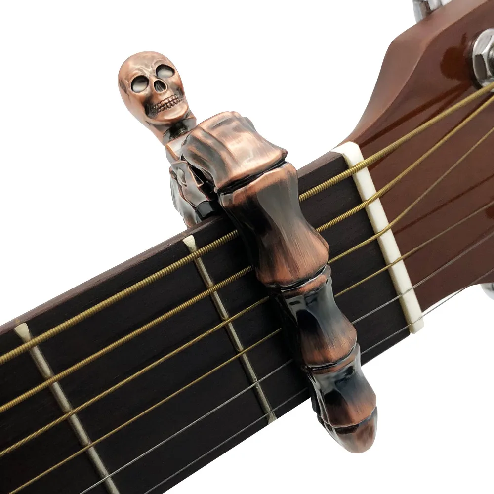 SLOZZ cráneo Guitarra Capo 6 cadena clásica acústica Guitarra eléctrica bajo accesorios Metal Capotraste Guitarra hueso del dedo SLOZZ cráneo Guitarra Capo 6 cadena clásica acústica Guitarra eléctrica bajo accesorios Metal Capotraste Guitarra hueso del dedo