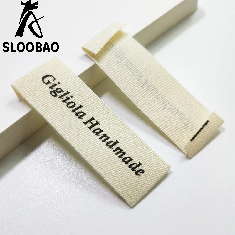 

Sloobao 500pcs Custom Own Logo Design Cotton Labels Lovely Washable Folded Flag Tags for Garment Bags DIY Sewing Accessories