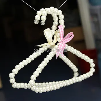 

10PCS/LOT Plastic Pearl Bow Baby Clothes Hangers & Racks and Pet Dog Cat Pearl Hangers Clothing Store Baby Supplies