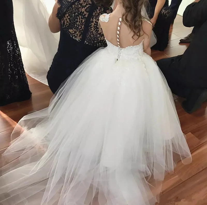 cute-white-sheer-neck-flower-girls-dresses-for-wedding-lace-appliqued-princess-girls-pageant-dresses-sleevess-floor-length-wears-for-girl.webp (1)_