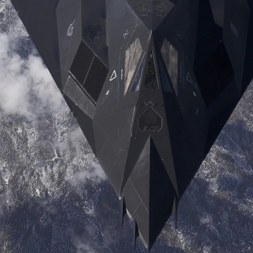 An F-117A Nighthawk flies high over the mountains Poster Print (38 x 19)