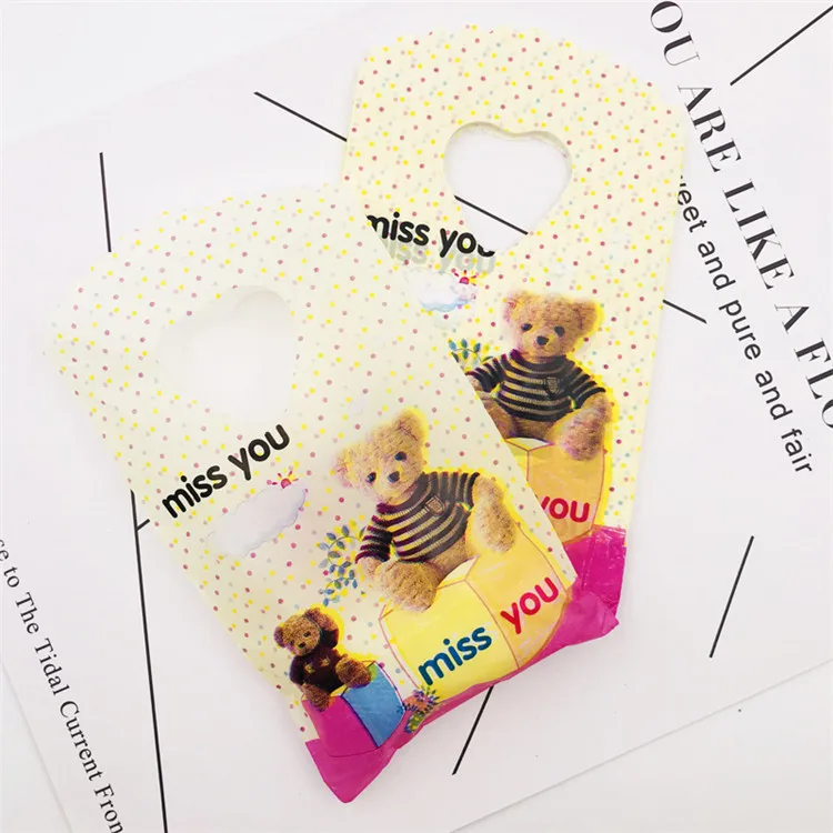 Милые мини-19 видов стилей, 50 шт./лот, маленькие пластиковые сумки с ручками, 9x15 см, вечерние подарочные сумки для конфет, упаковки ювелирных изделий с ручками - Цвет: Yellow Black Bear