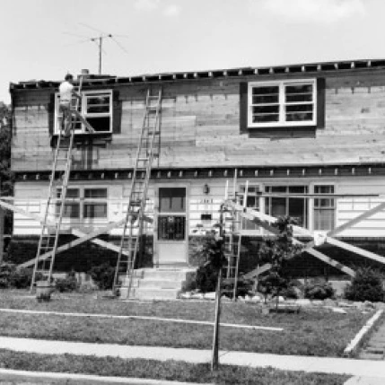 Man adding dormers to a house Poster Print (18 x 24)
