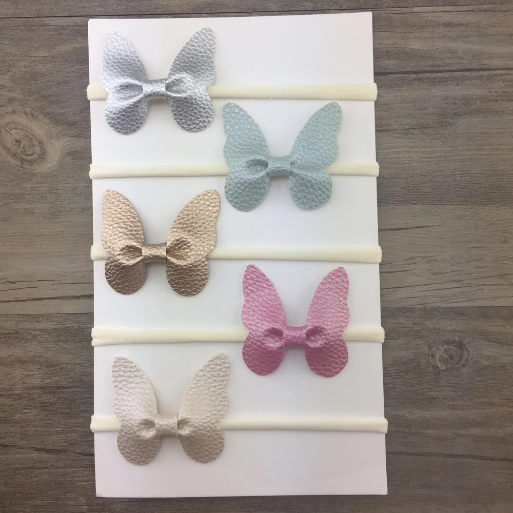 

Boutique 12pcs Fashion Cute Leather Butterfly Newborn Soft Hair Bands Solid Hair Bow Nylon Headbands Headwear Accessories
