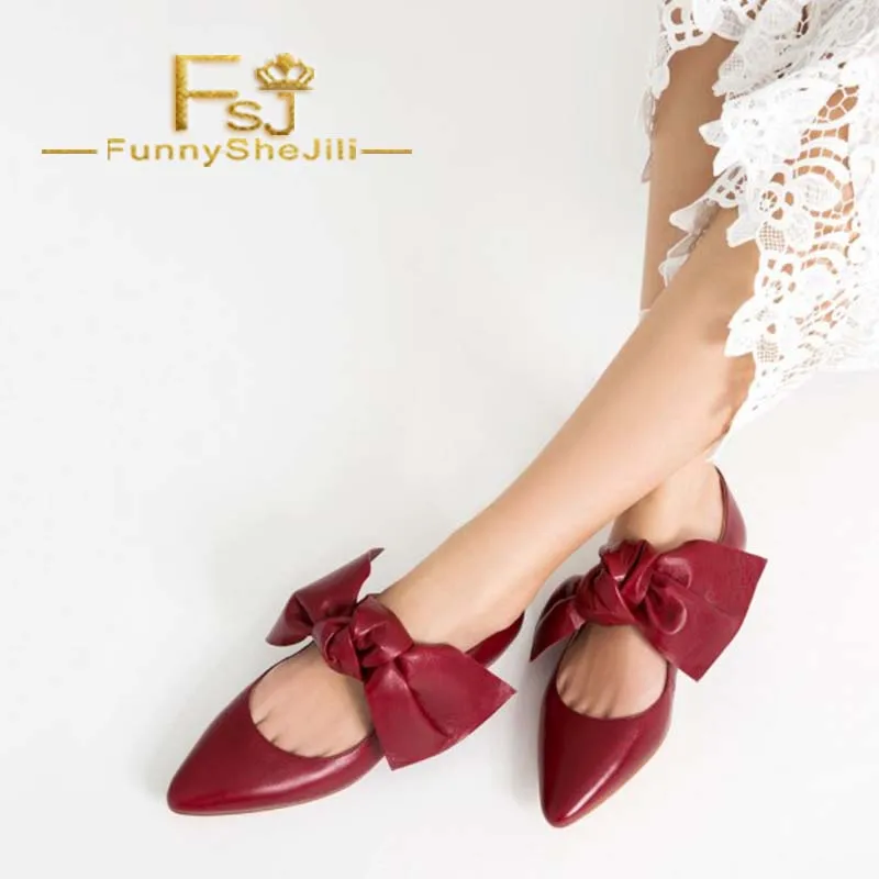 red flat shoes with bow