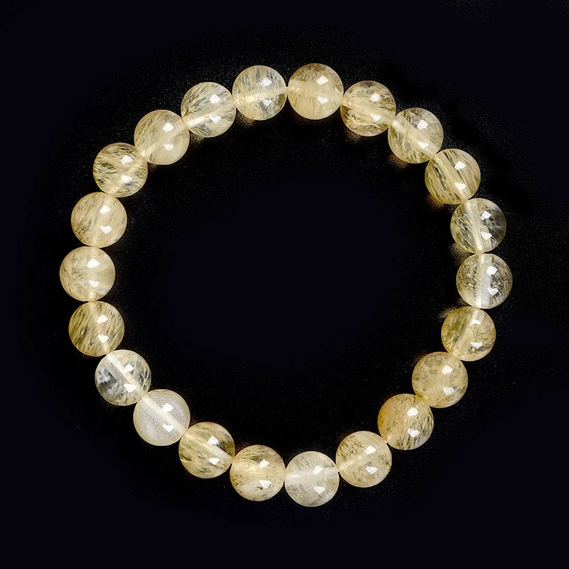 

Yellow and white color phase spacing 8 mm with bright beads of topaz and piezoelectric Synthesis Crystal bracelet.