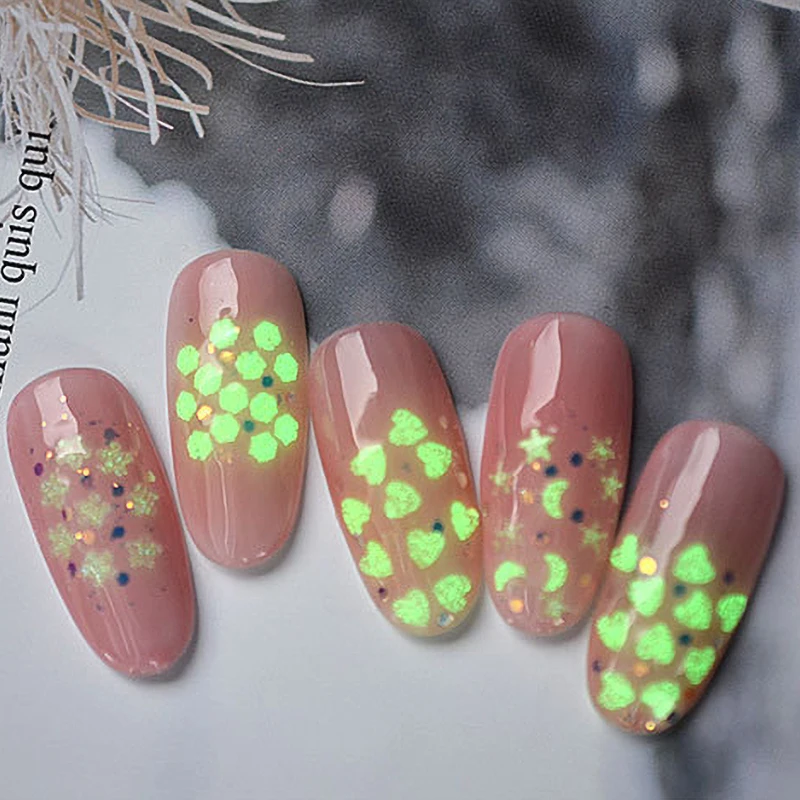 

1 Box Nail Art Sequins Fluorescent Luminous Heart Moon Flowers Pattern Ultra--thin Flakes Power Glow in the Dark Nail Tips Decor