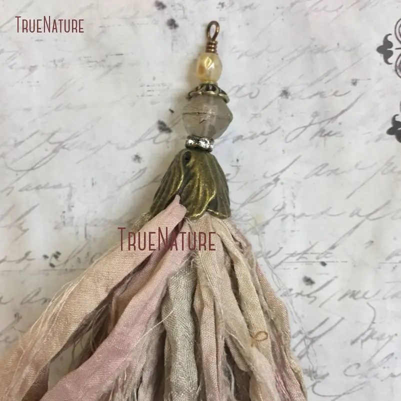 TPO14382-Sari Silk Tassel Pendant Natural Beige Hints Of Pink Sari Silk Bohemian Style Tassel Pendant Antique Brass Flower Bead Cap  (1)