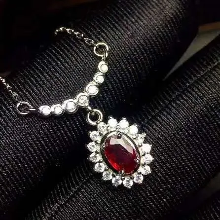 

Natural ruby pendant,No fire,Pigeon blood red ruby.Shining, crystal clear, bright red.The main stone 4*6mm,925 silver Seiko mosa