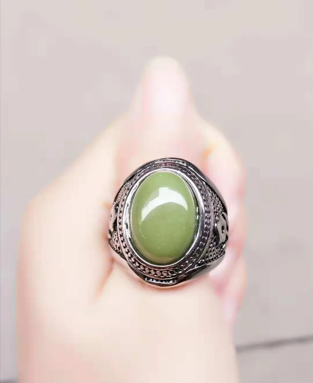 

Beautifully inlaid fluorescent stone ring
