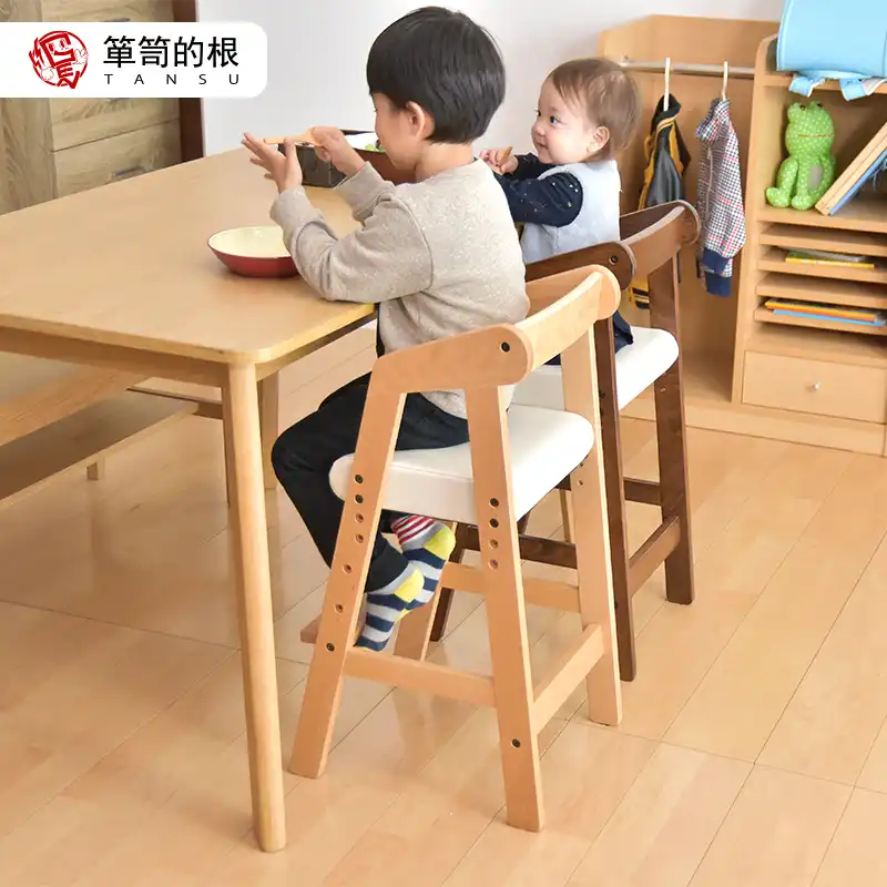wooden high chair that grows with child