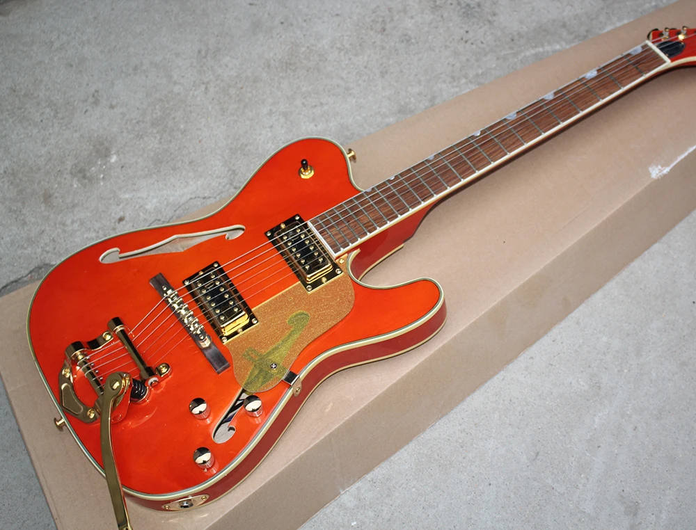 

Factory Orange Electric Guitar with Gold Pickguard,Chrome Hardware,Rosewood Fretboard,Tremolo System,Can be Customized