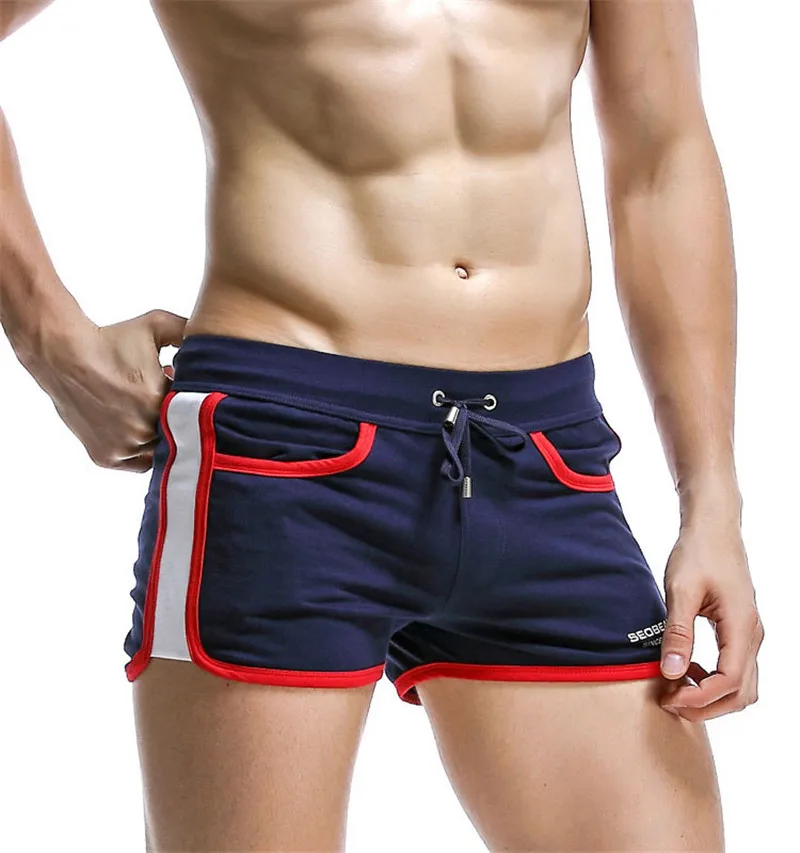 Летние мужские пляжные шорты, сплошной цвет, сексуальный хлопок, с заниженной талией, штаны со стрелкой, быстросохнущие спортивные шорты для серфинга