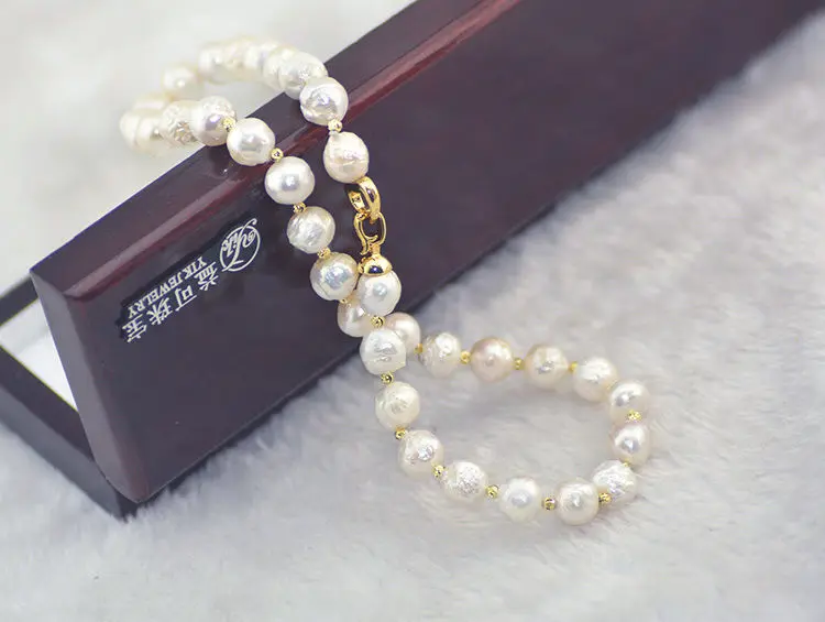

stunning natural baroque 12mm south sea kasumi white pearl necklace 18