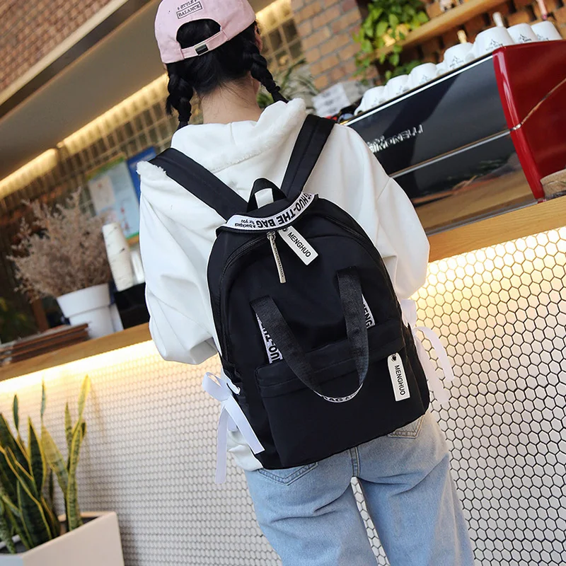 Menghuo حقيبة ظهر بسعة كبيرة النساء Preppy المدرسة حقائب للمراهقين الإناث النايلون السفر أكياس الفتيات Bowknot على ظهره Mochilas