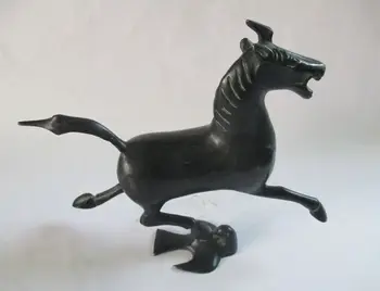 

Ancient Chinese bronze statue. The horse stepped the swallow
