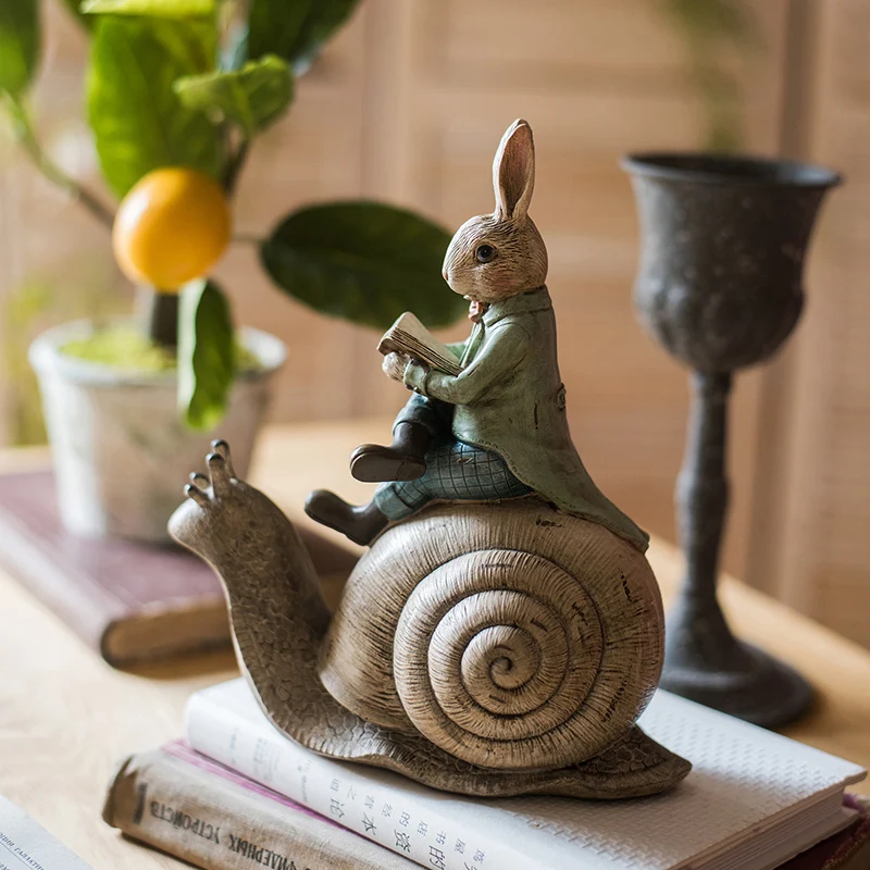 

Home Decoration Accessories Gentleman Rabbit Sitting On The Snail'S Back Reading A Book Decor Figurine Living Room Ornament Gift