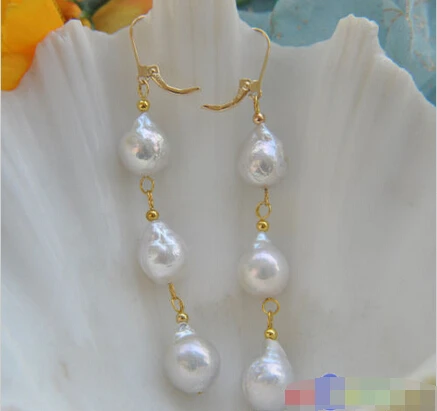 

A 13MM WHITE ALMOST ROUND KESHI REBORN PEARL DANGLE EARRING 14K