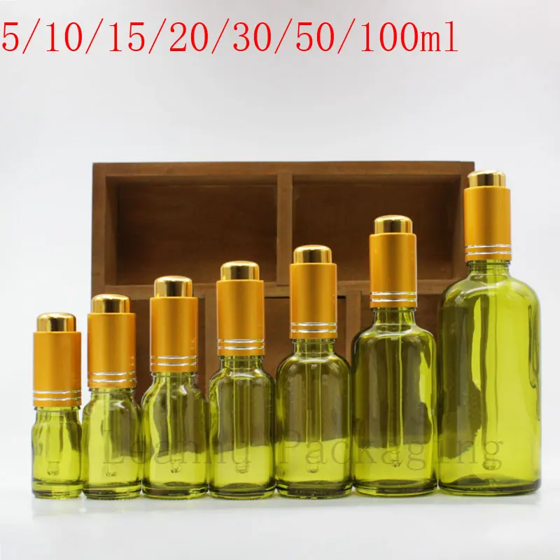Download Green Essential oil Bottle With Frosted Golden Cap ...