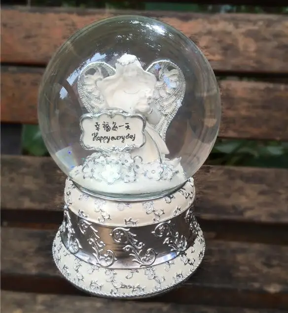 

Happy angel crystal ball rotating music box