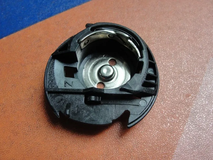 

Multi-function sewing machine bobbin case 89210