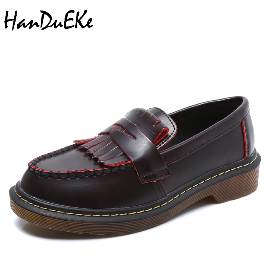black tassel flats