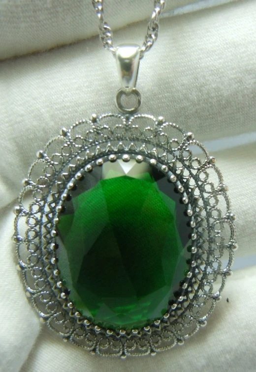 

The new 2014 emeralds 925 sterling silver restoring ancient ways is hollow-out decorative pattern Noble pendant jewelry