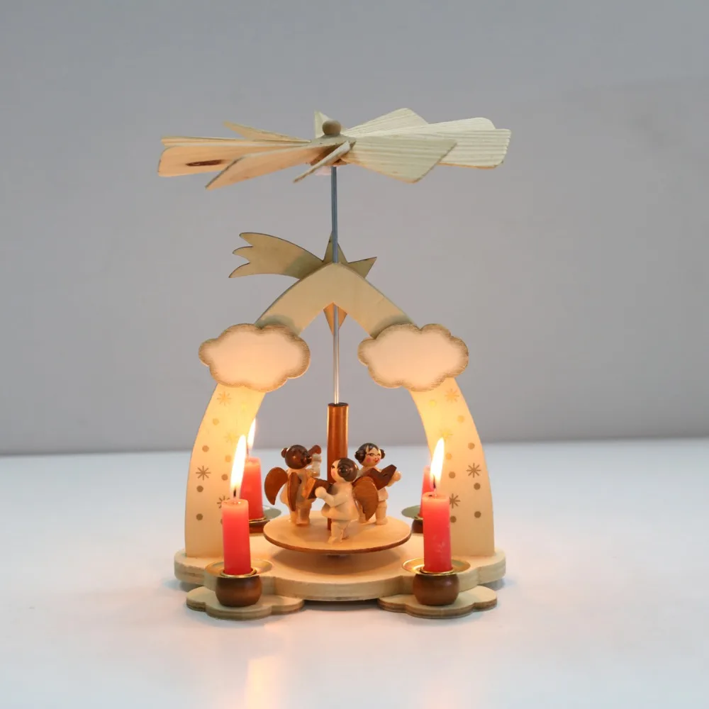 

Christmas wooden pyramid with hand-painted nativity figurines with turning wings with 4 candleholders