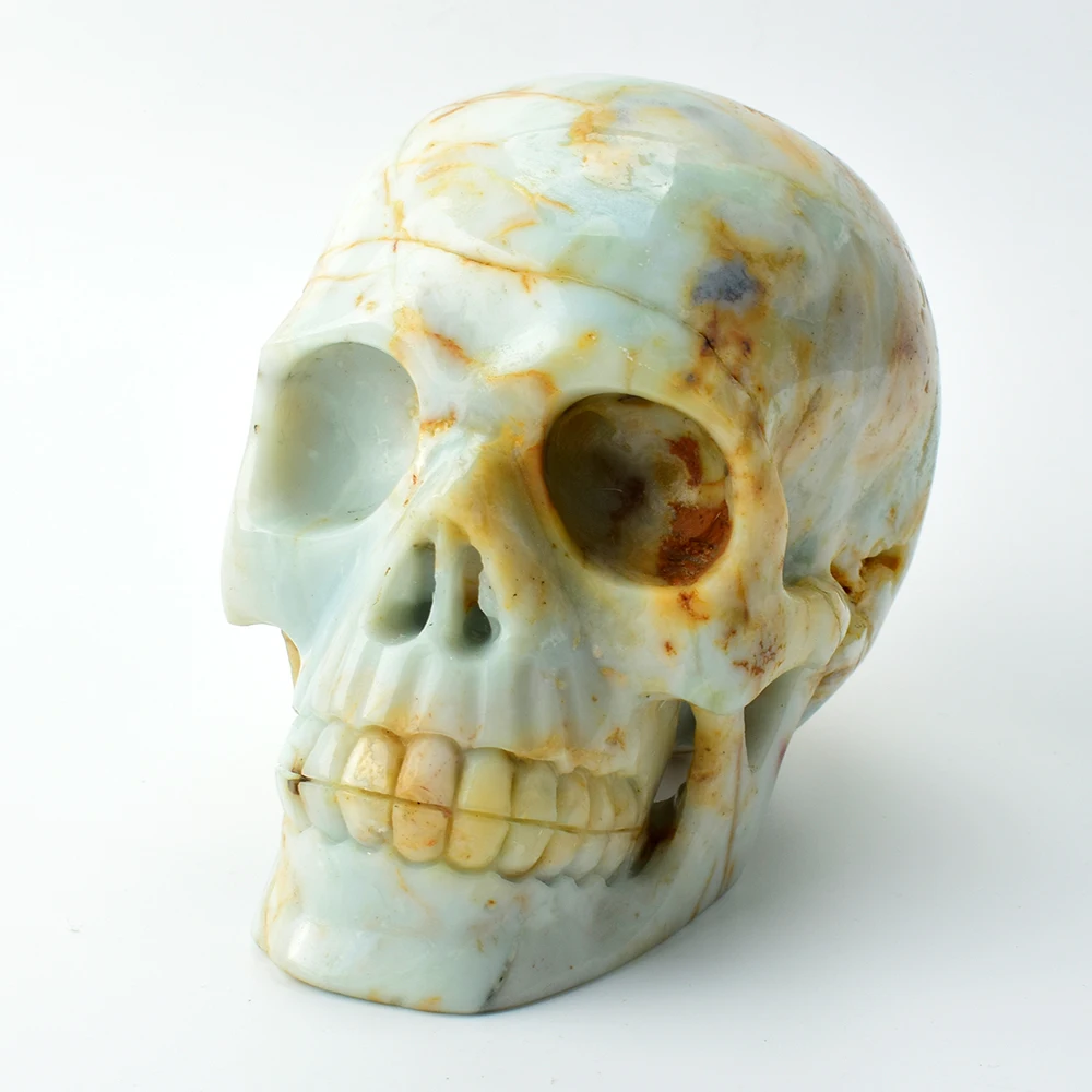

5. 9'' Crystal Skull Natural Amazon Stone Engraved Super Realistic Human Head Figurine Stones and Crystals Statue Home Decor