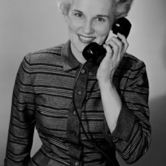 Portrait of mature woman talking on phone Poster Print (24 x 36)