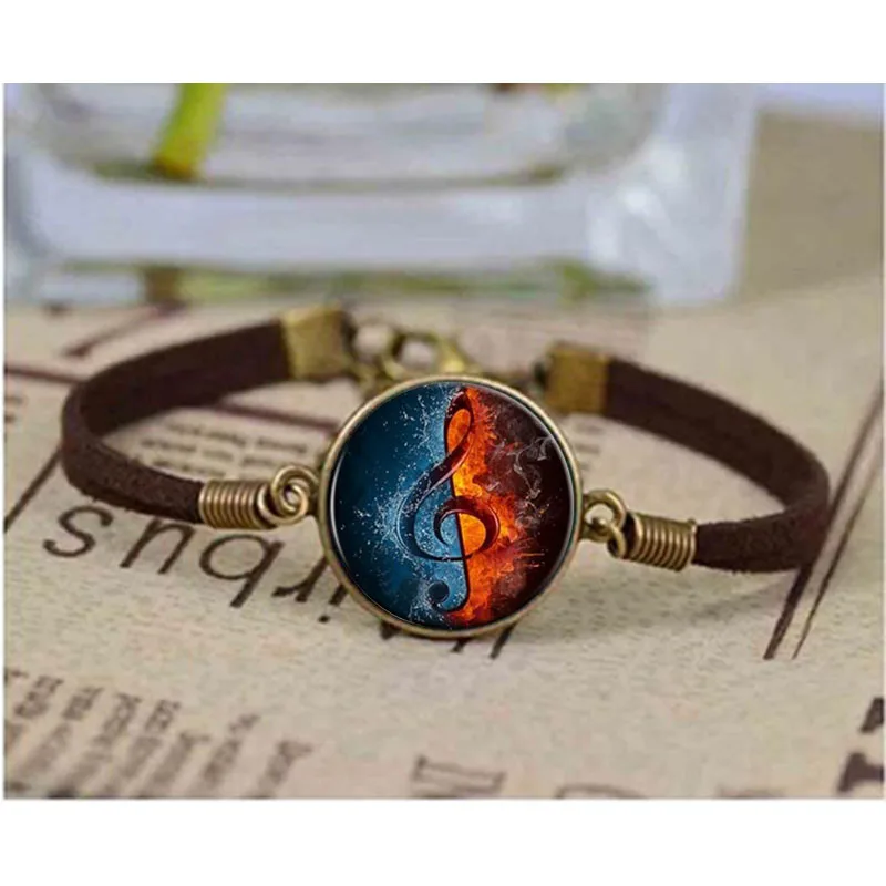 

Free shipping fashion musical notes bracelet music is one half water and one half fire Zinc alloy Glass bracelet retro bracelets