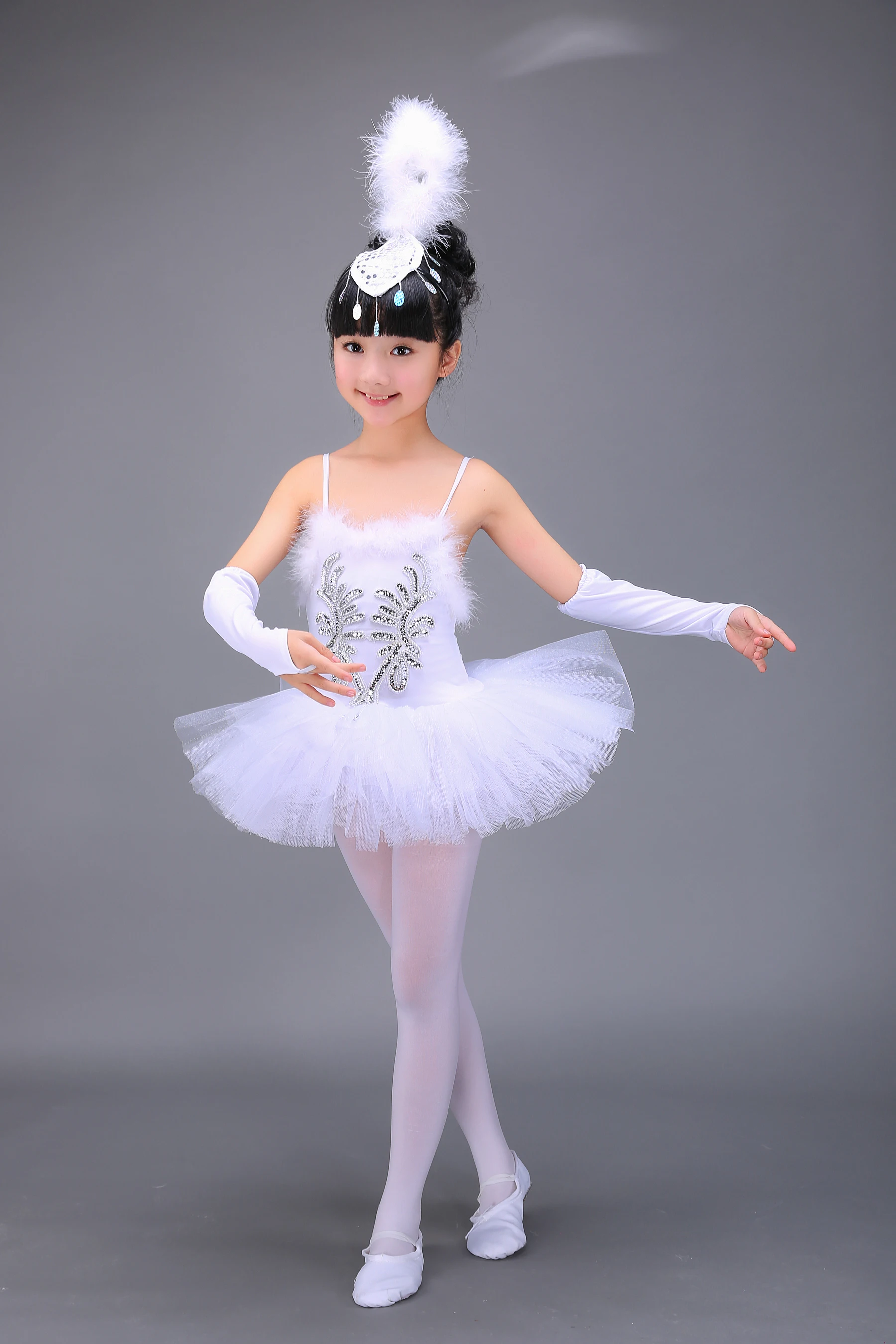 Add a sweet gathered tulle skirt to a store-bought tee for a ballet-style dress for a little girl. Easy sewing tutorial includes step-by-step photos.