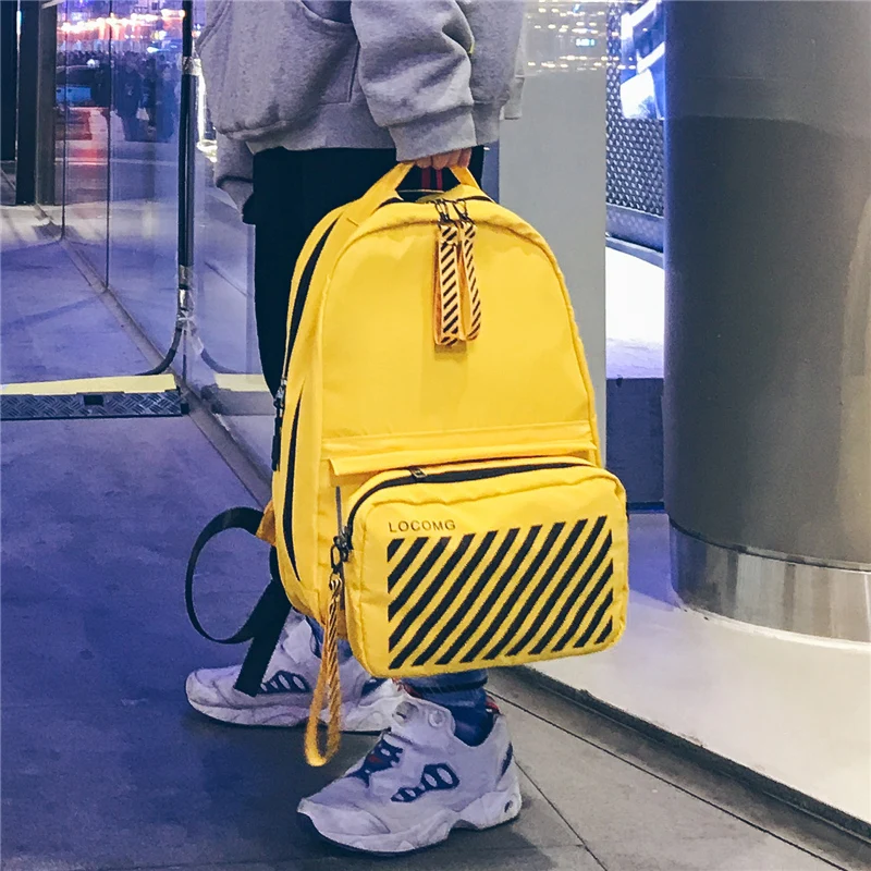 

Contrast color backpack street trend new Korean version of the wild large capacity campus men and women high school student bag
