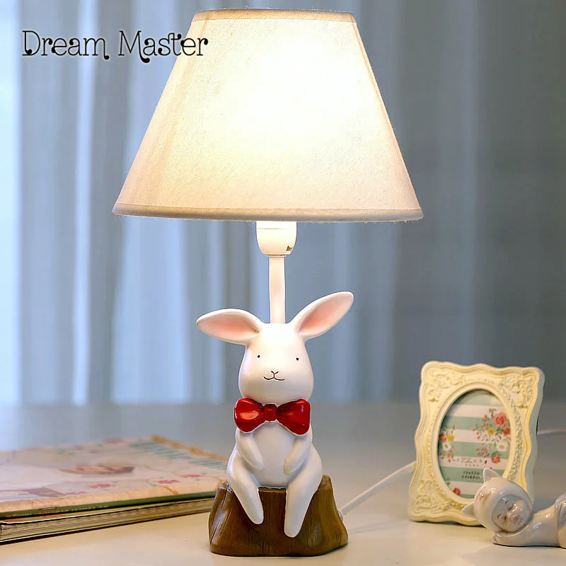 The small white rabbit lamp warm bedroom bedside lamp dimming creative