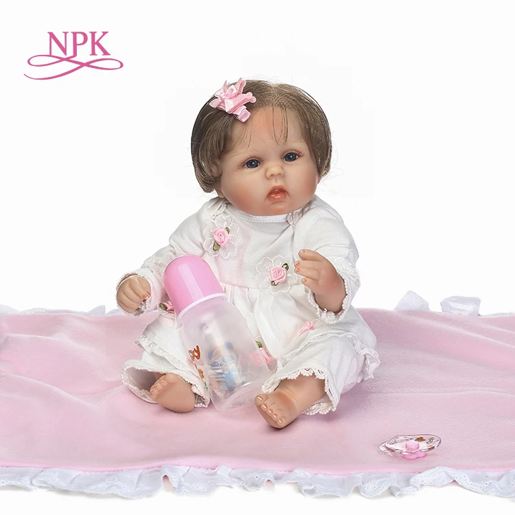 

NPK bebes reborn lovely premie baby doll rooted hair and with cloth body very soft touch and best gift for children