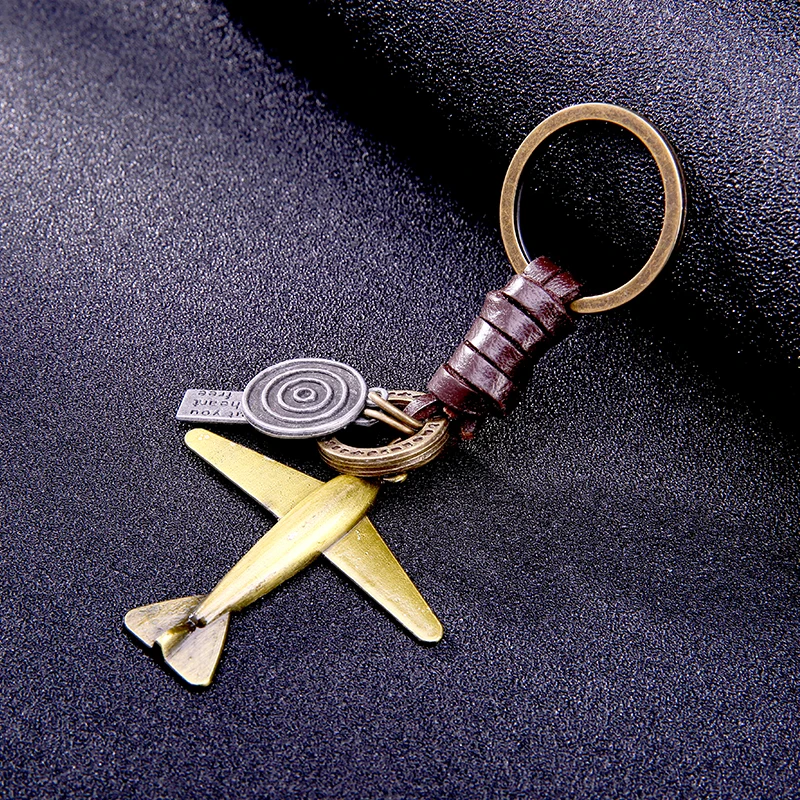 

Fashion aircraft shaped trinket men keychain key chains locksmith Hand weaving cowhide bronze rucksack buckle car ring gifts