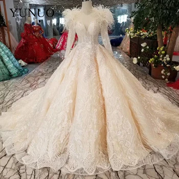 شراءYuNuo مصمم Vestidos دي Novias س الرقبة طويلة الأكمام الكرة ثوب ريشة فساتين الزفاف