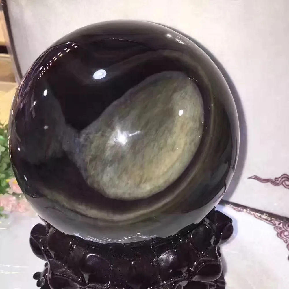

The natural beauty of obsidian ball!Rainbow three eye