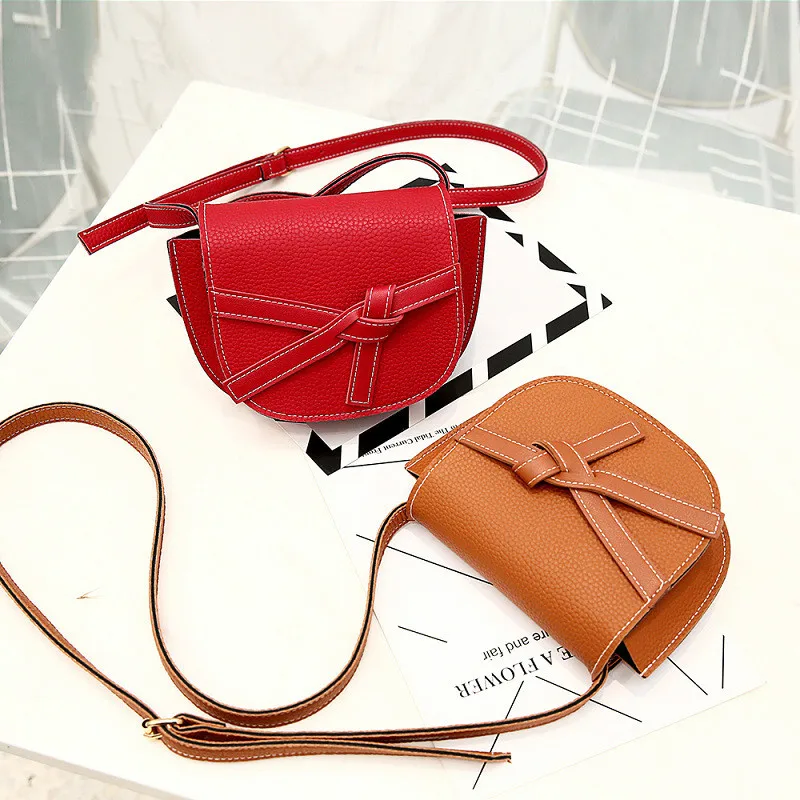 

2019 latest bow saddle contrast solid color one shoulder 21X16.5X5CM fashion high quality wild Messenger bag