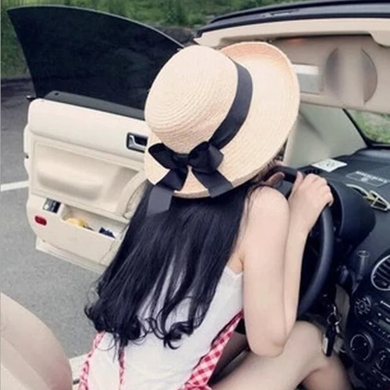 1 قطعة الصيف جديد المرأة قبعة الشمس الأسود Bowknot الشريط التشفيه القش قبعة الشاطئ قبعات محيط الرأس 56-58 سنتيمتر 3 ألوان