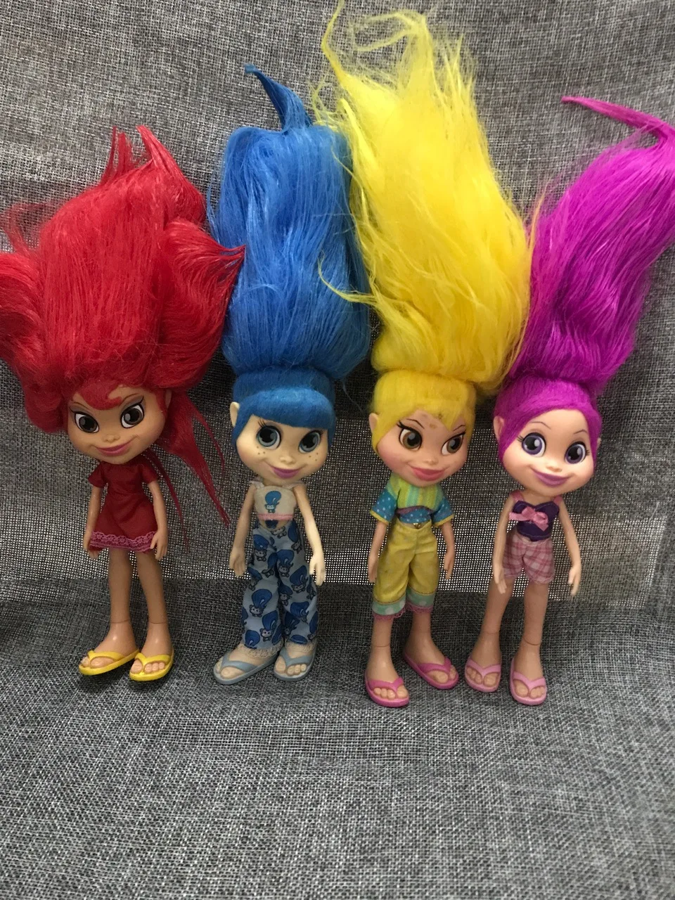 toy trolls with colored hair