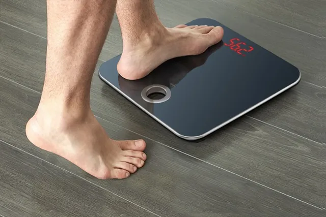 Image result for weight machine with human weight