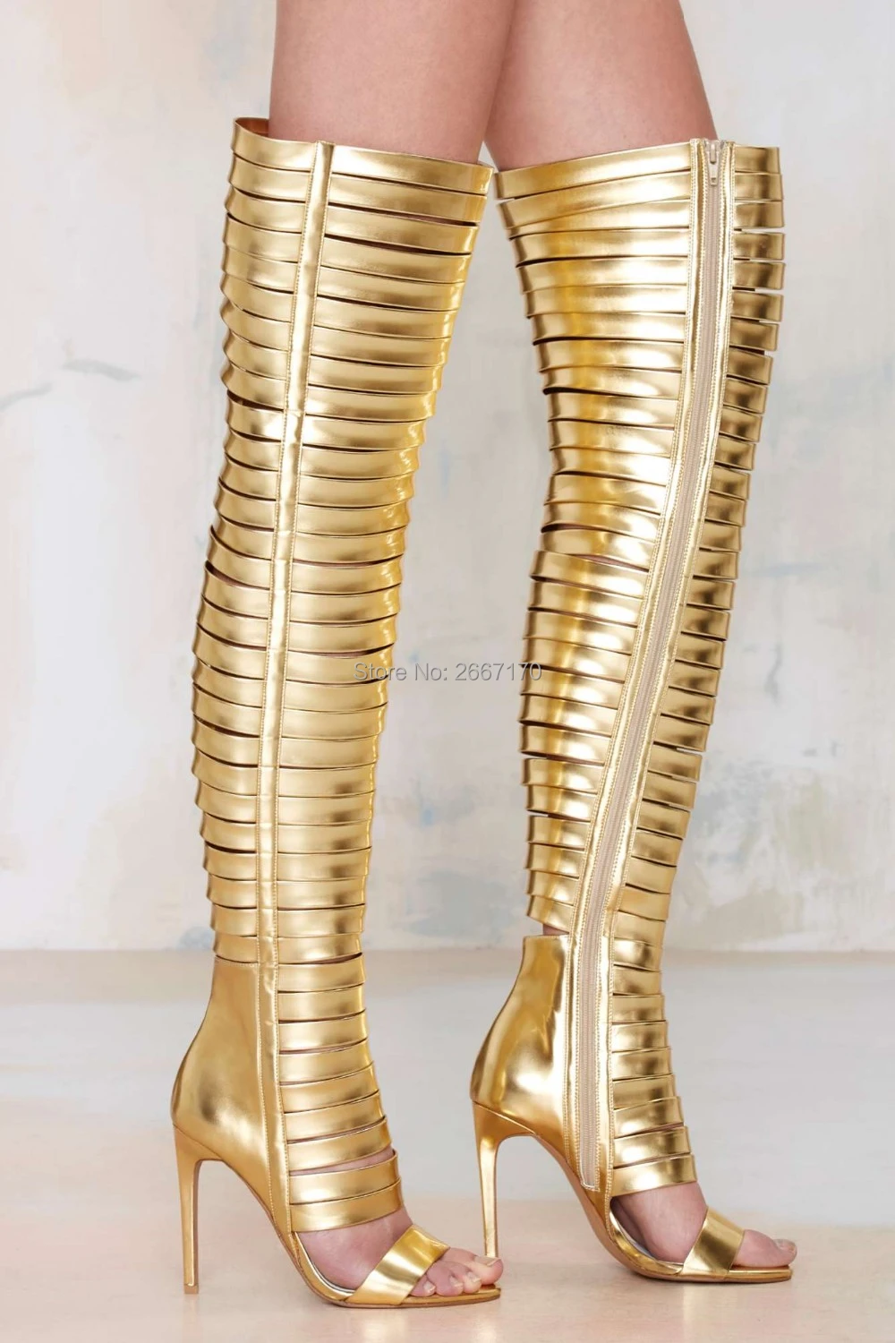 black and gold over the knee boots