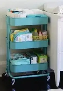 Carts. Multilayer metal receive a shelf in the kitchen.
