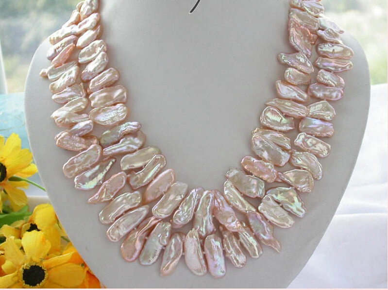 

A 2ROW 19" 28MM PINK DENS BIWA CULTURED PEARL NECKLACE