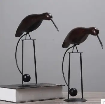 

Scandinavian wooden birds are decorated in the living room window display