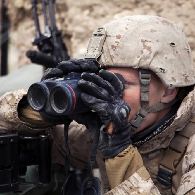 U.S. Marine scans for enemy positions during Operation Bullseye Poster Print (34 x 22)